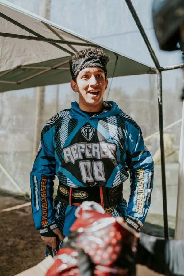 Man Smiling After a Game of Paintball