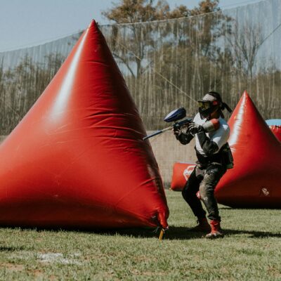 Woman with Rifle in Paintball Game