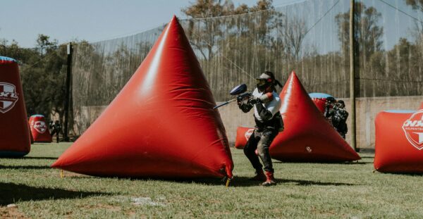 Woman with Rifle in Paintball Game